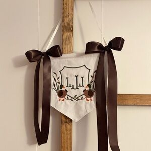 Cream Banner with Brown Ribbons and Embroidery
